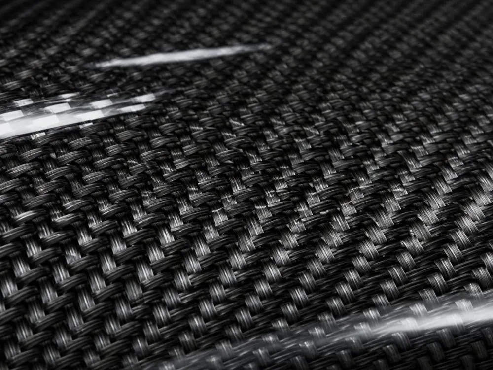 Close-up of carbon fiber weave texture for automotive parts