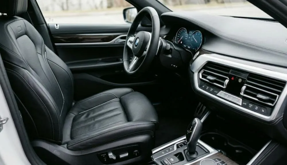 Close up of leather car seat and clean dashboard details