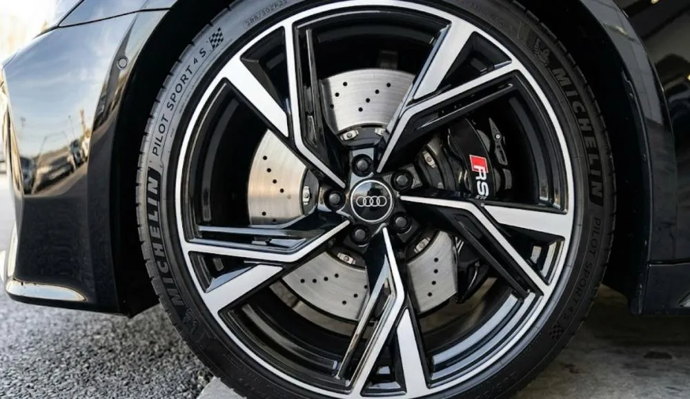 Luxury car wheel detail with clean brake and rim close up