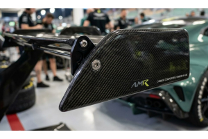 Close-up_detail_of_carbon_fiber_on_a_performance_car_part.